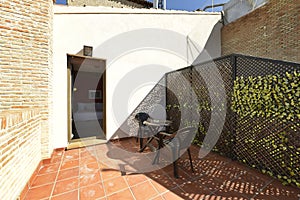 Terrace in a penthouse apartment with black wooden latticework