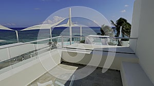 Terrace of a resort with the Caribbean landscape in the background typical of a white sandy beach with crystal clear turquoise