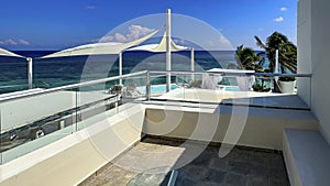 Terrace of a resort with the Caribbean landscape in the background typical of a white sandy beach with crystal clear turquoise