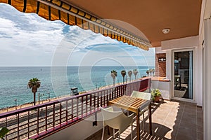 Terrace with table against city beach in Vilassar de Mar photo