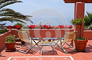 Terrace, table, chairs and sea views photo