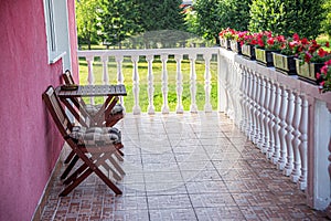 Terrace with a table and flowers.