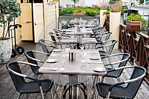 Terrace with tables, chairs and cutlery in philipsburg, sint maarten. Restaurant open air. Eating and dining outdoor. Summer vacat