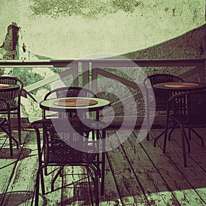 terrace tables and chairs in a small cafe