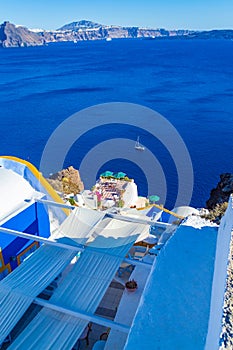 Picturesque terrace in Oia town Santorini and Caldera seascape Greece