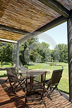 Terrace with wooden table and chairs