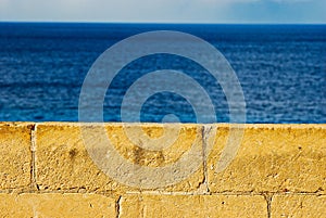 Terraced antic wall of Ulysses Lodge ruins in Gozo Malta island Ramla bay