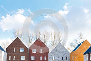 Terraced houses with minimalist design and classic gabled roof