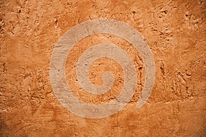Terracotta colored plaster wall
