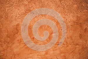 Terracotta colored plaster wall