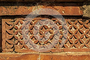 Terracotta patterns ancient stone carving, pattern on the stone wall of Bagha Shahi Mosque