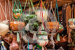 Terracotta pots and pans hanging in a shop in Cuenca, Ecuador