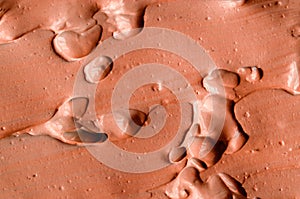 Terracotta red clay texture close up, selective focus. Abstract background.
