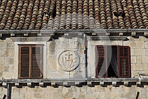 Terracotta roofs and windows with shutters