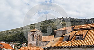 Terracotta rooftops beneath Srd Hill