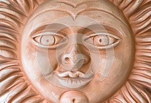 Terracotta sun face