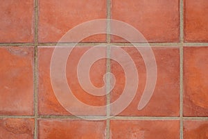 Terracotta tiled floor background - terracotta tiles closeup photo