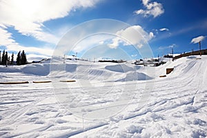 terrain park with various snowboarding features photo