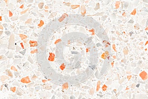 Terrazzo flooring which has Orange rock Small or marble old. polished stone wall beautiful texture for background