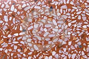 Terrazzo or polished stone flooring white and light brown on background