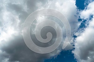 A terrible black cloud hangs in the sky before the rain. Bad weather. Hurricane and thunder over the city. Climate change and photo