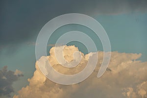 A terrible black cloud hangs in the sky before the rain. Bad weather. Hurricane and thunder over the city. Climate change and photo