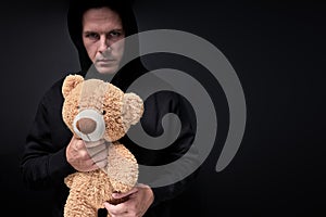 Terrible Maniac Pedophile Man With Toy Teddy In Hands, Looking At Camera 