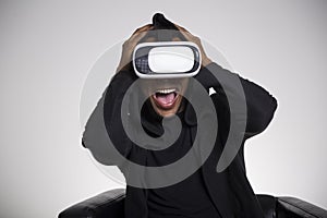 Terrified African American man playing vr game