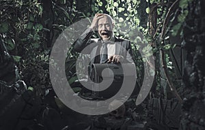 Terrified businessman lost in the jungle