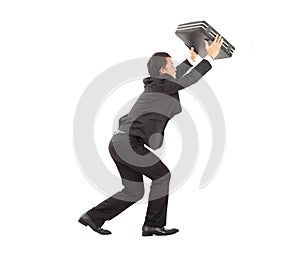 Terrified businessman using briefcase to protect.