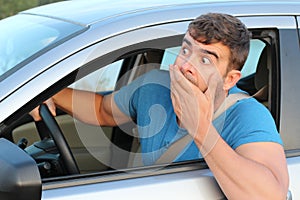 Terrified male driver feeling guilty