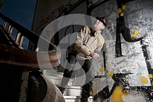 Terrified man walking down the stairs