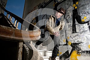 Terrified man walking down the stairs