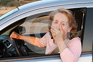 Terrified mature female driver feeling guilty