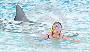 Terrified swimmer fleeing from white shark.