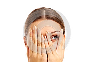 Terrified woman covering her face