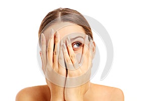 Terrified woman covering her face