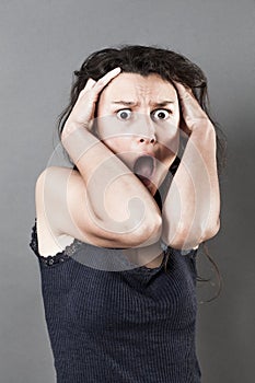 Terrified woman panicking expressing consternation