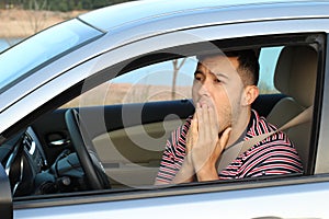 Terrified young male driver feeling guilty