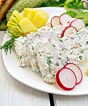 Terrine of curd with potatoes on light board