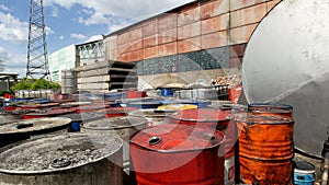 On the territory of a closed plant there are tanks with spent oil products