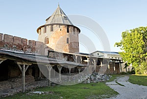 territory inside the Kremlin of Veliky Novgorod, Russia, terracotta round tower with Windows, the medieval fortress, the path , b