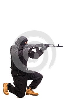 Terrorist with weapon on a white