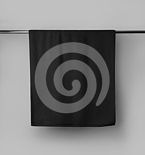 Terry black towel template with a label on a metal tube, hanging towelling for design, branding