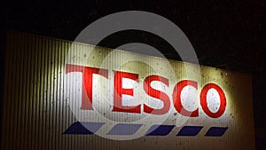Tesco logo on supermarket sign