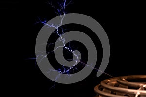 Tesla coil electrical resonant transformer circuit high voltage power generator, electric lightning, object detail, closeup, photo