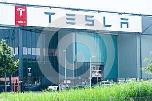 Tesla factory and service point building front in Tilburg, Netherlands - editorial image