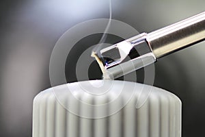 Tesla lighter ignites candle wick