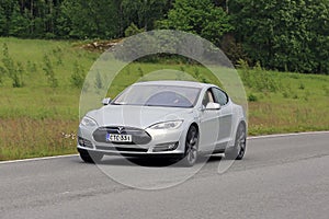 Tesla Model S Electric Car on Summer Road