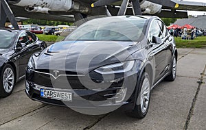 Tesla Model X full electric luxury crossover SUV car on display at exhibition